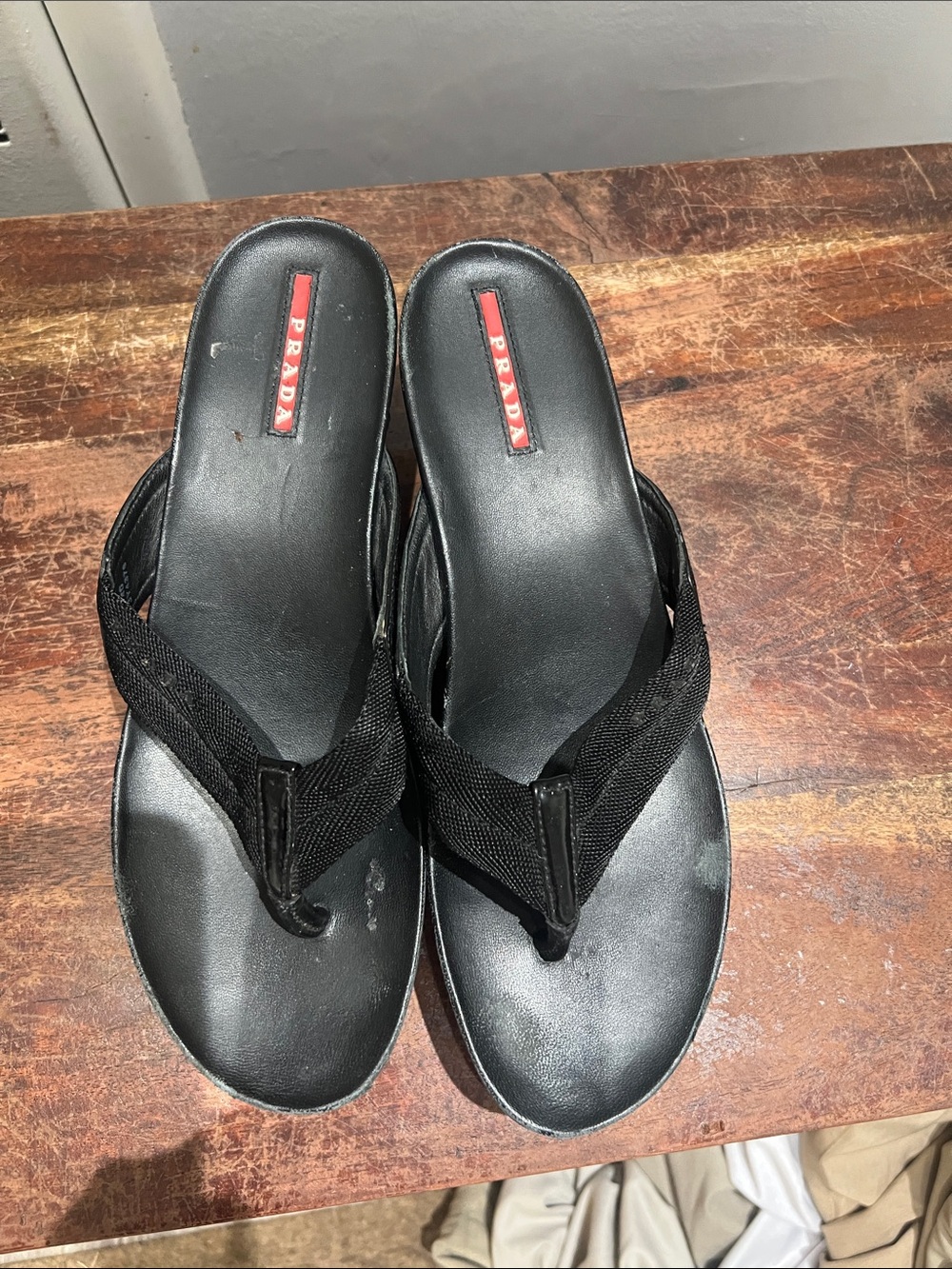 Prada Men’s Black Leather & Fabric Flip-Flop Sandals bottom cracked